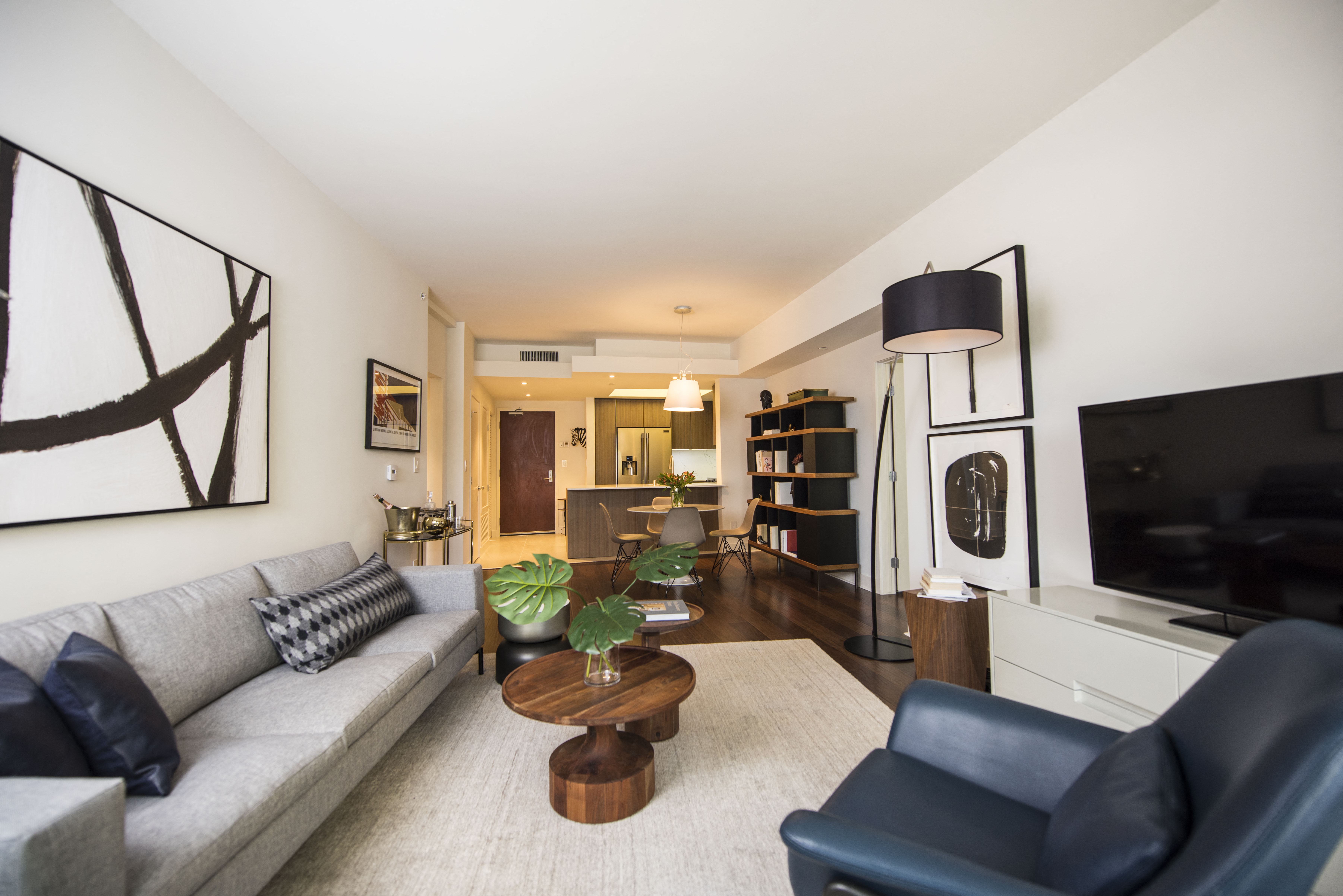 a living room with a gray couch and a coffee table